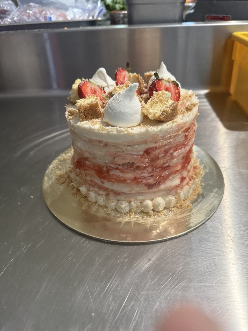 Alfonso’s strawberry layer cake topped with strawberries and cream